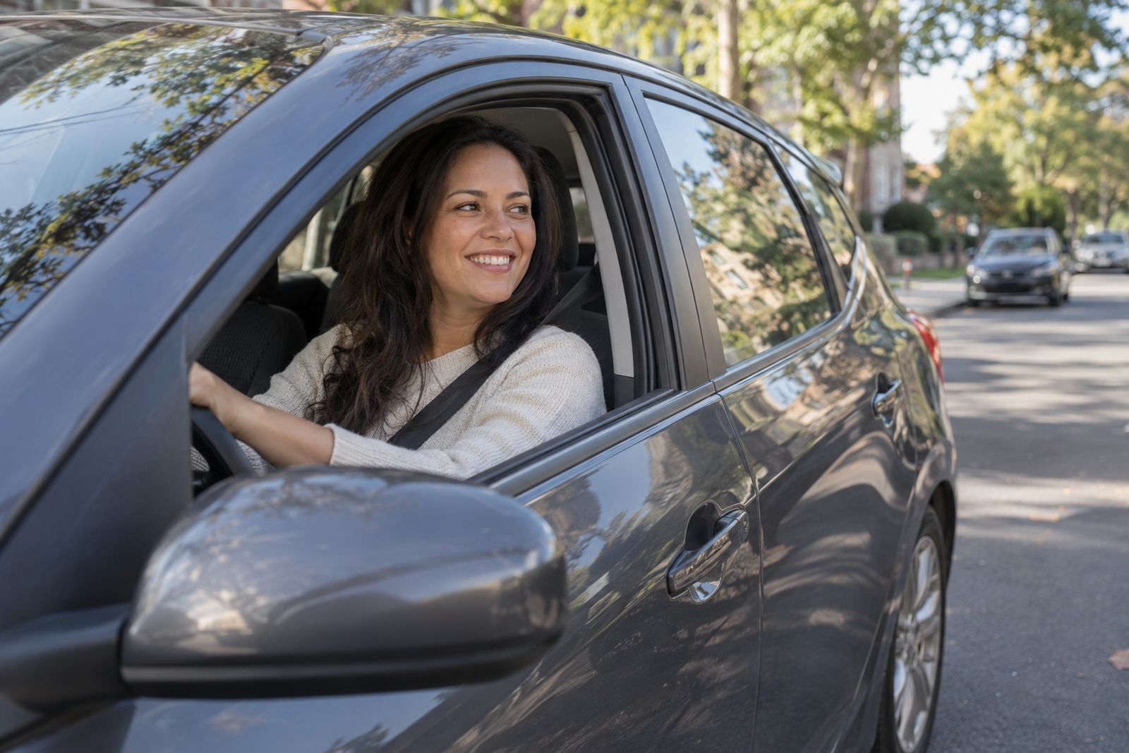 Woman driving her car on a city street