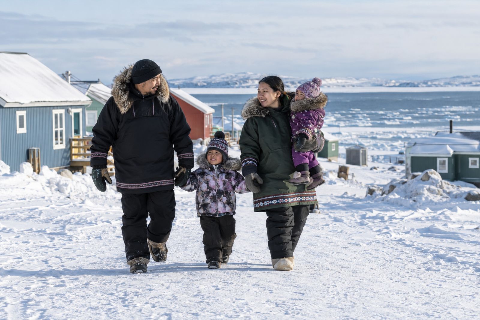 Family walking in a northern community in Nunavut
