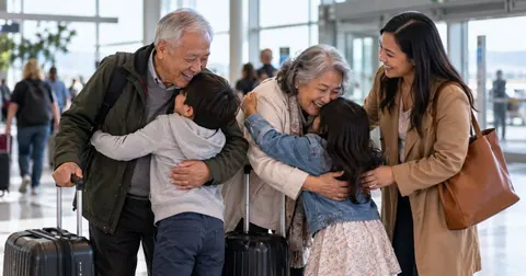 Family welcoming grandparents at the airport